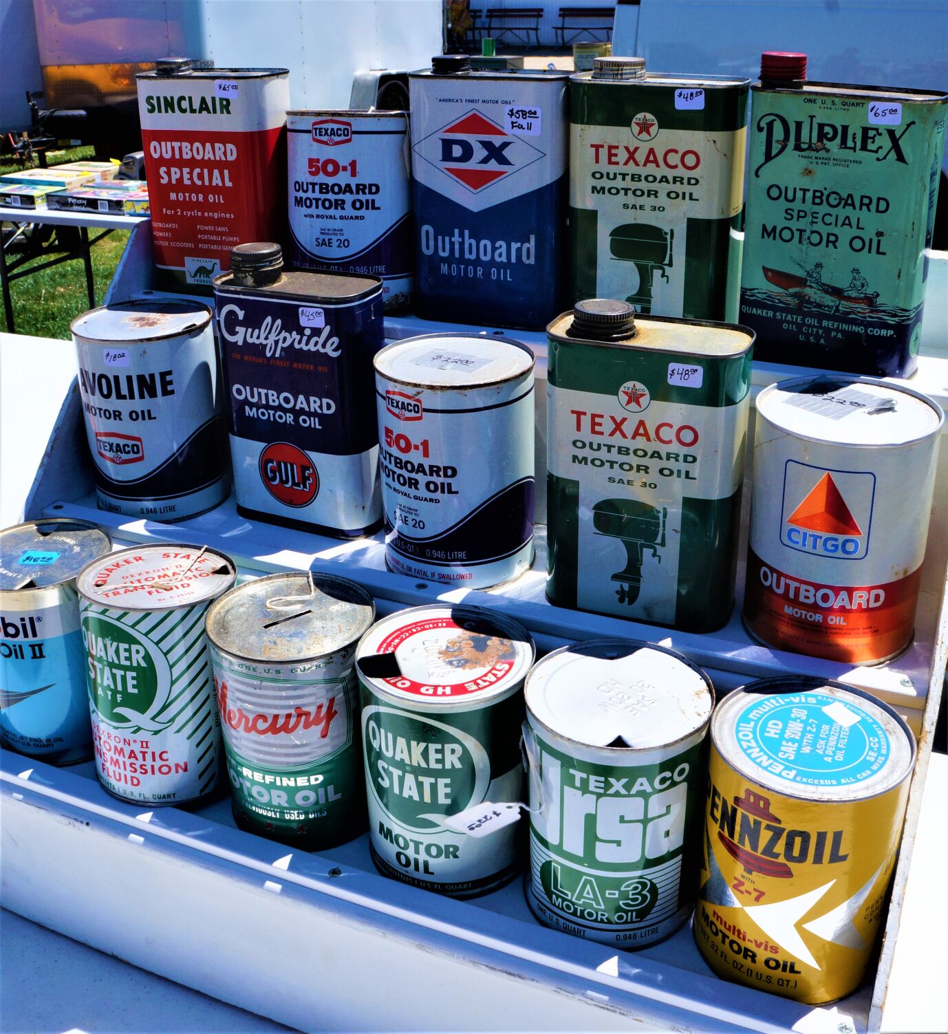 Oil cans for sale at the June 26 Elkhorn Antique Flea Market